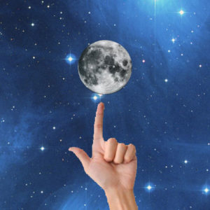 finger pointing at the moon